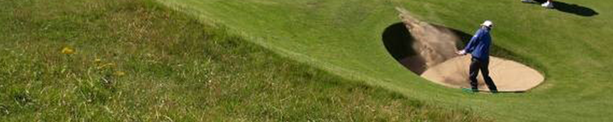 A man playing golf in a golf course